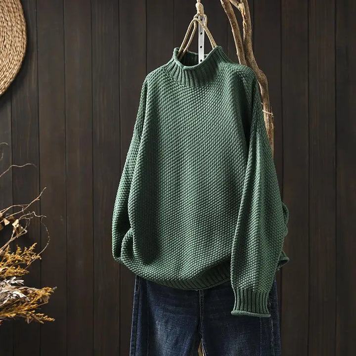 Γυναικείο πλεκτό oversized πουλόβερ με όρθιο γιακά και ασύμμετρο τελείωμα