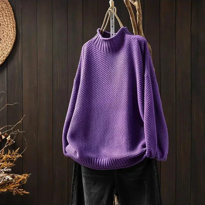Γυναικείο πλεκτό oversized πουλόβερ με όρθιο γιακά και ασύμμετρο τελείωμα