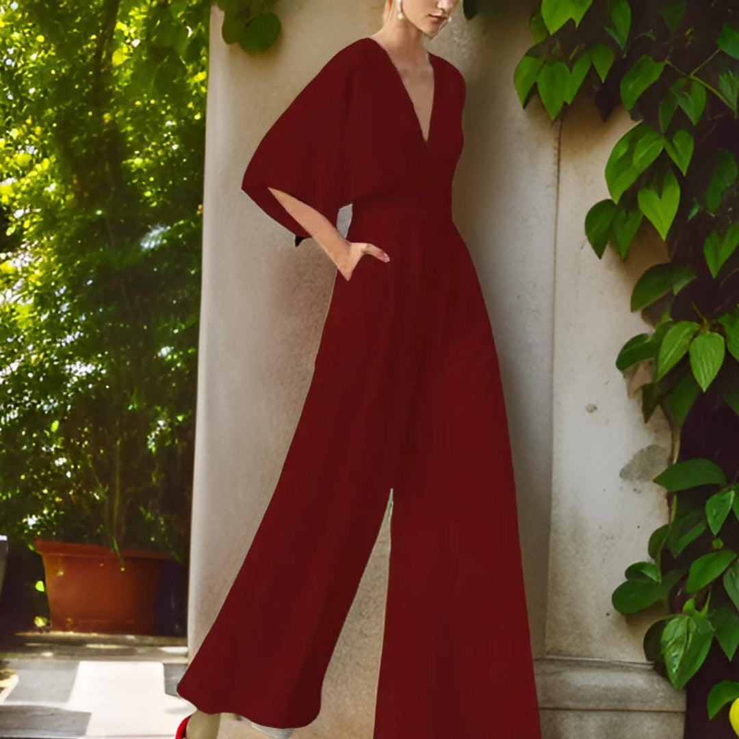 Elegantní dámský overal ze šifonu s výstřihem do V, polovičními rukávy a širokými nohavicemi